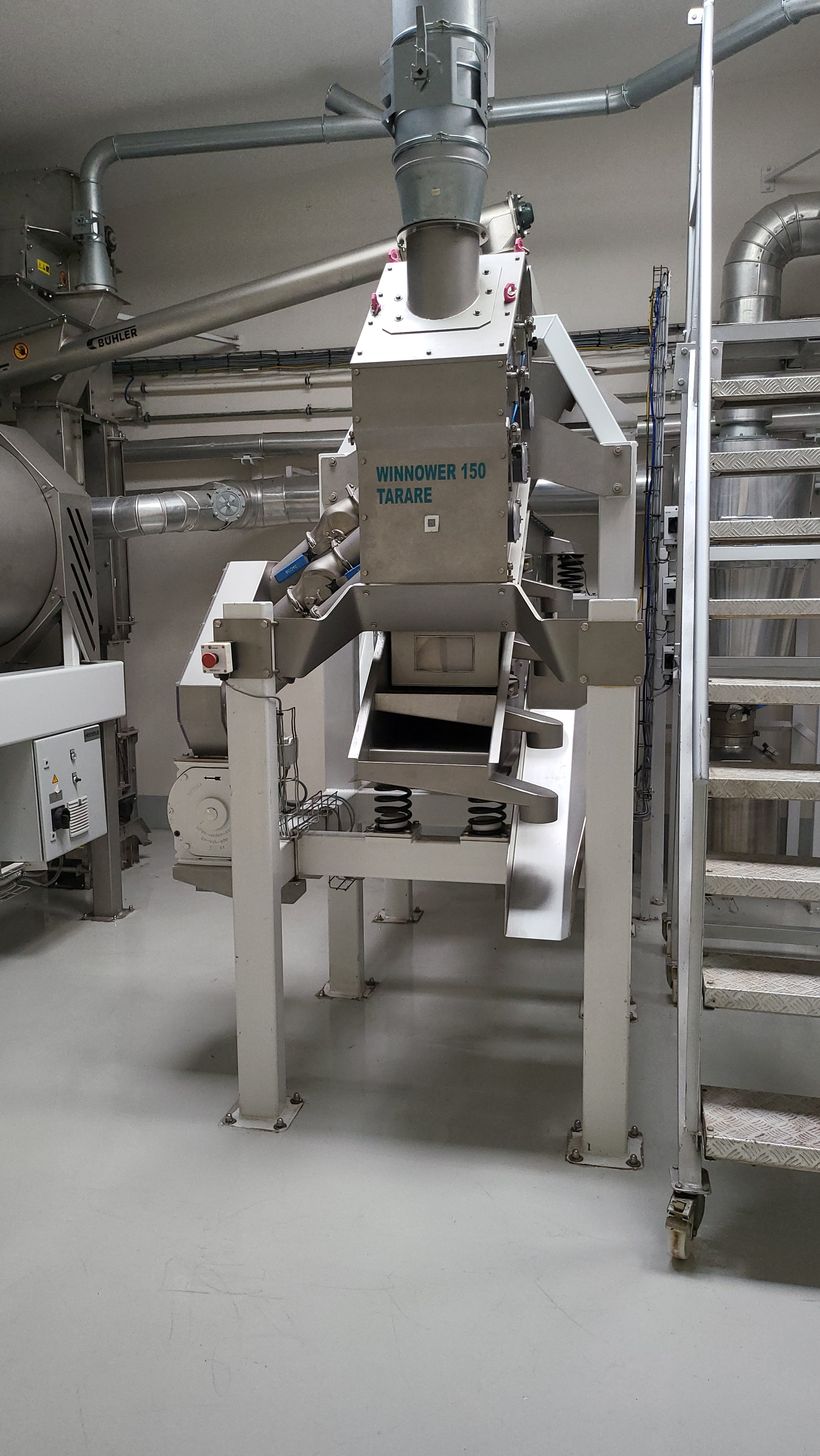 Cocoa winnowing at the processing plant
